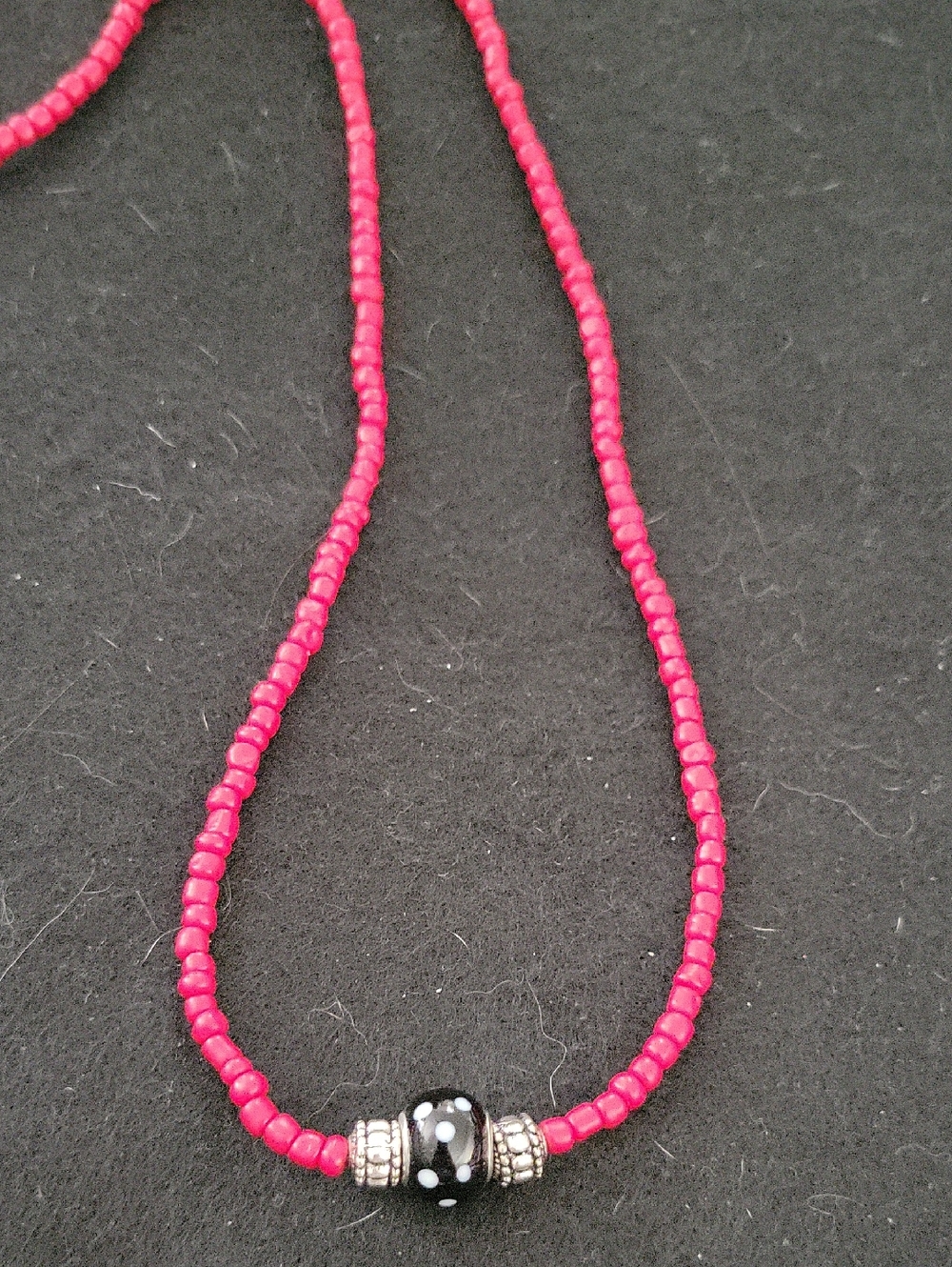 Source Unknown Red Beaded Necklace with Black and White Accent Bead